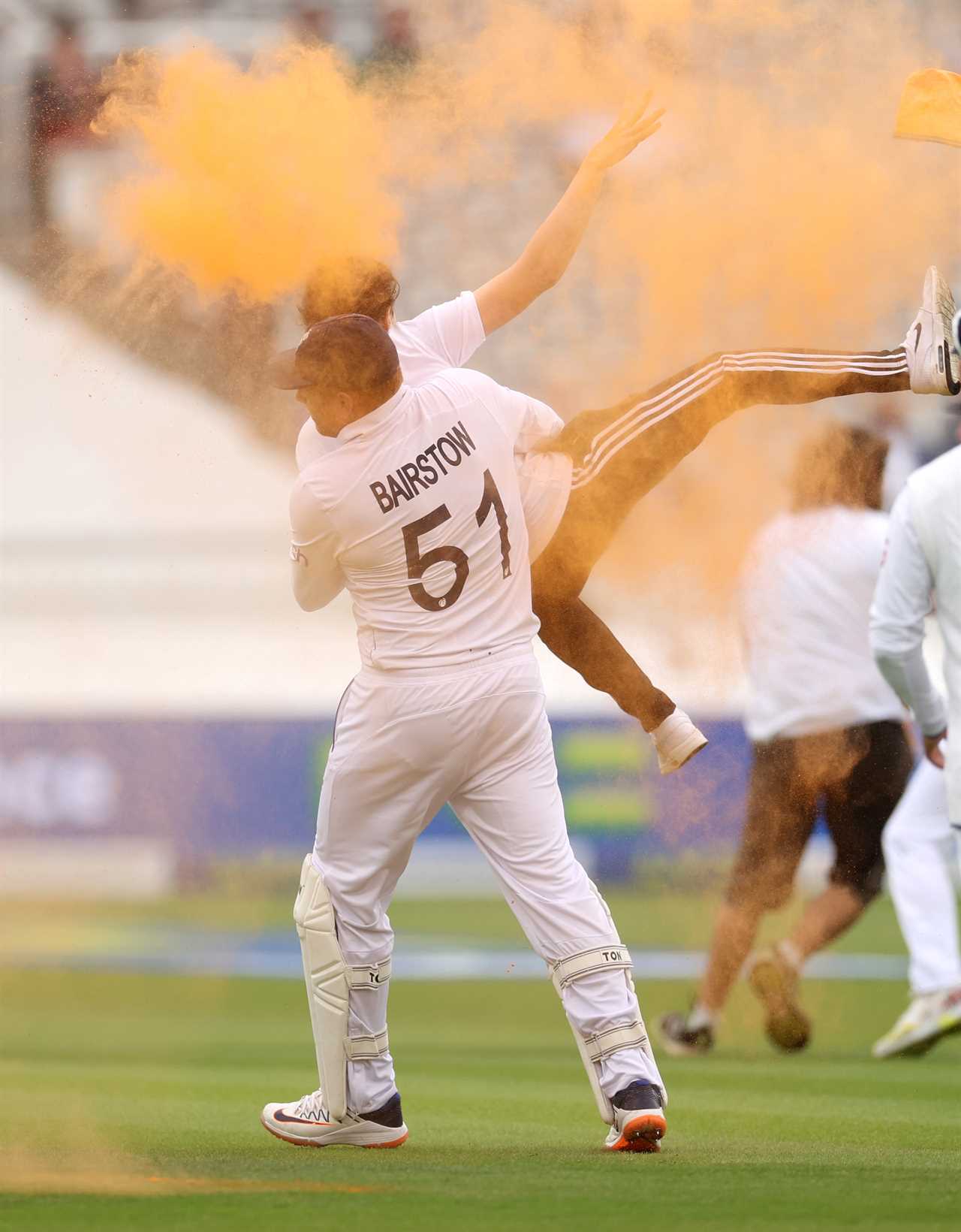 LONDON, ENGLAND - JUNE 28: Jonny Bairstow of England tackles a "Just Stop Oil" pitch invader during Day One of the LV= Insurance Ashes 2nd Test match between England and Australia at Lord's Cricket Ground on June 28, 2023 in London, England. (Photo by Ryan Pierse/Getty Images)