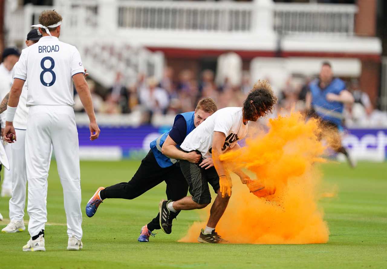 Security grab a Just Stop Oil protester during day one of the second Ashes test match at Lord's, London. Picture date: Wednesday June 28, 2023. PA Photo. See PA Story CRICKET England. Photo credit should read: Mike Egerton/PA Wire. RESTRICTIONS: Editorial use only. No commercial use without prior written consent of the ECB. Still image use only. No moving images to emulate broadcast. No removing or obscuring of sponsor logos.