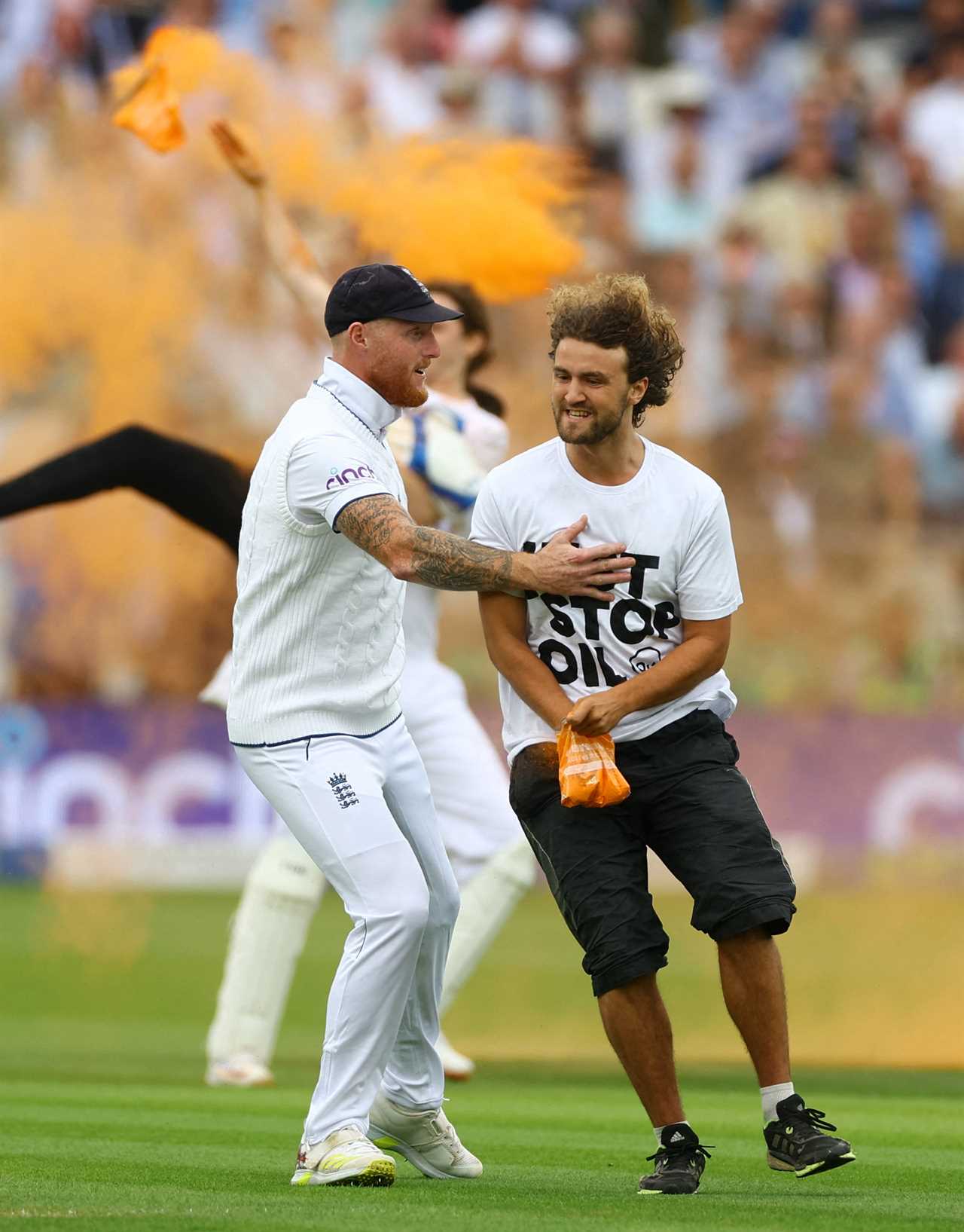 Cricket - Ashes - Second Test - England v Australia - Lord's Cricket Ground, London, Britain - June 28, 2023 England's Ben Stokes with a just stop oil protester Action Images via Reuters/Matthew Childs