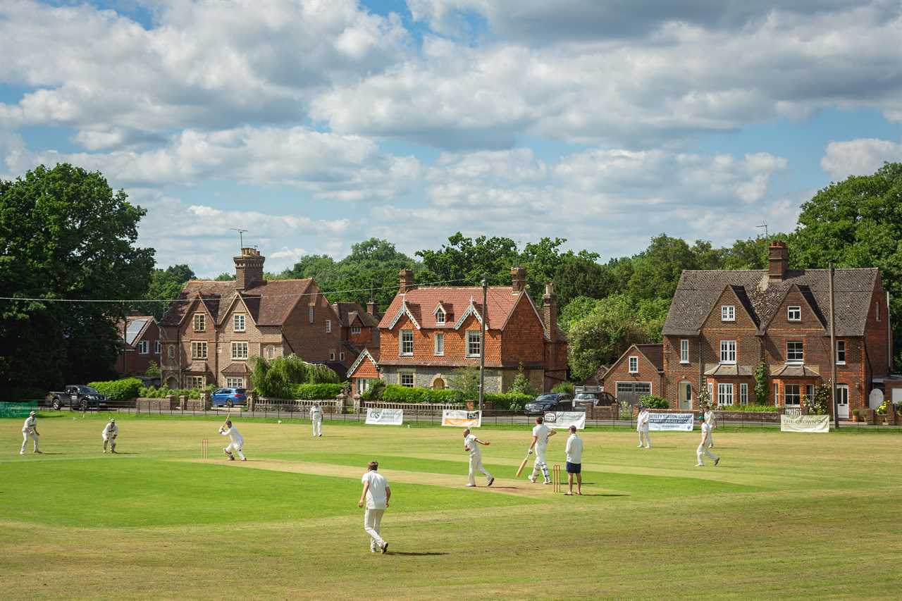 TR8TK9 A typical English village cricket scene at Chiddingfold Cricket Club in Sussex, England - June 2018.