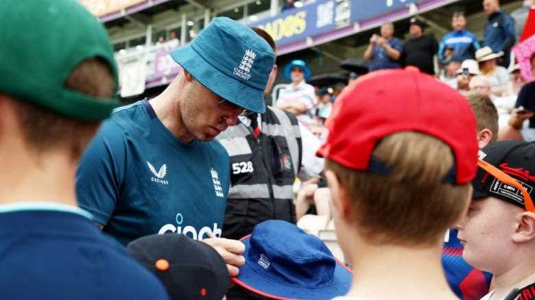 Andrew Flintoff signs autographs to fans after he coaches the England cricket team following Top Gear's horror crash
