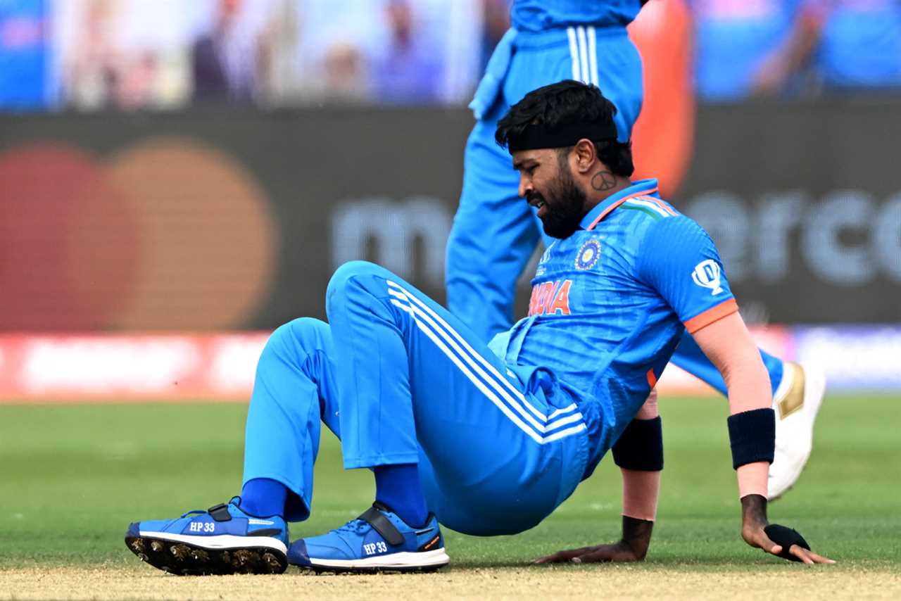 India's Hardik Pandya falls on the field during the 2023 ICC Men's Cricket World Cup one-day international (ODI) match between India and Bangladesh at the Maharashtra Cricket Association Stadium in Pune on October 19, 2023. (Photo by Punit PARANJPE / AFP) / -- IMAGE RESTRICTED TO EDITORIAL USE - STRICTLY NO COMMERCIAL USE -- (Photo by PUNIT PARANJPE/AFP via Getty Images)