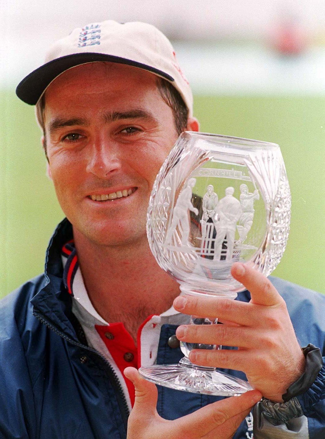 a man holding a trophy that says ' cricket world cup ' on it