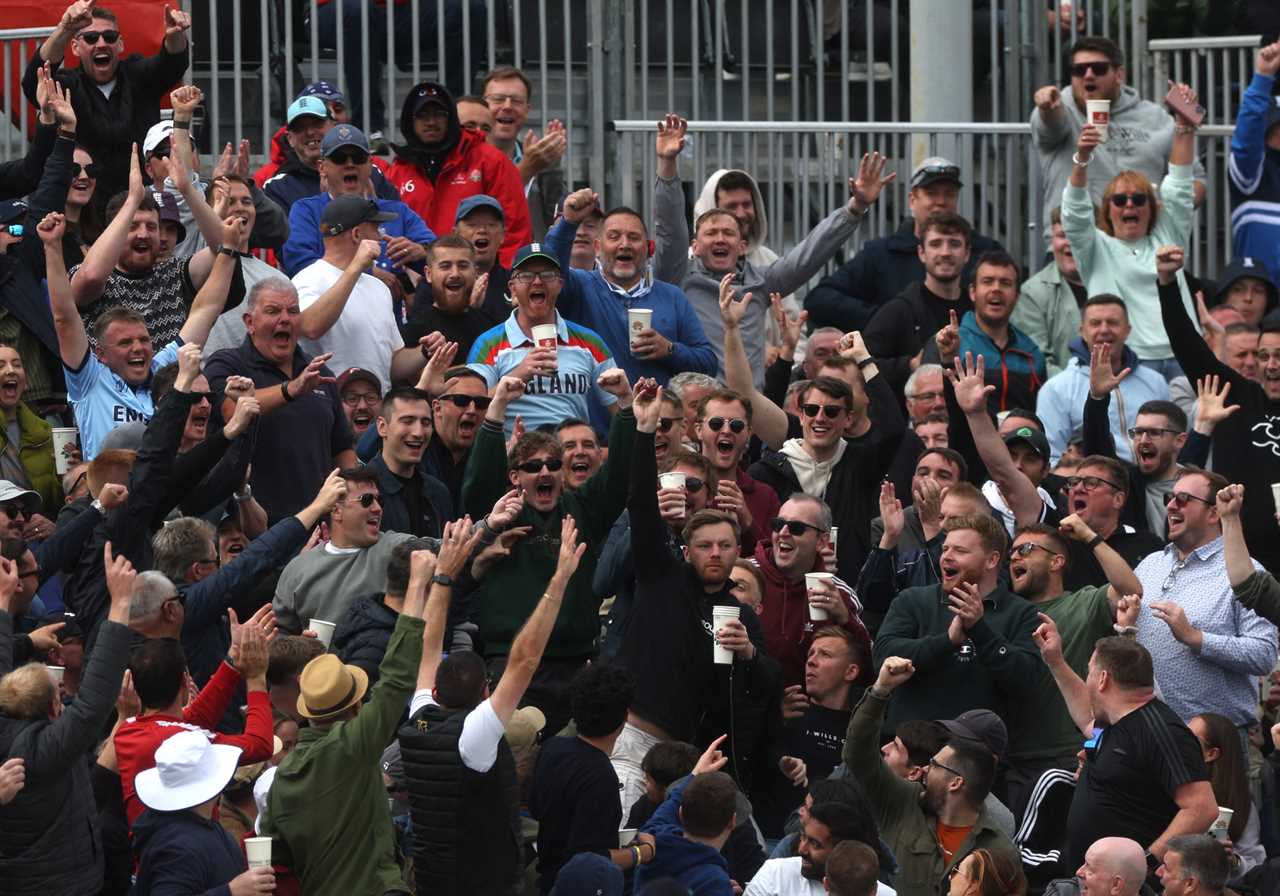 a crowd of people with one wearing a jersey that says celtic