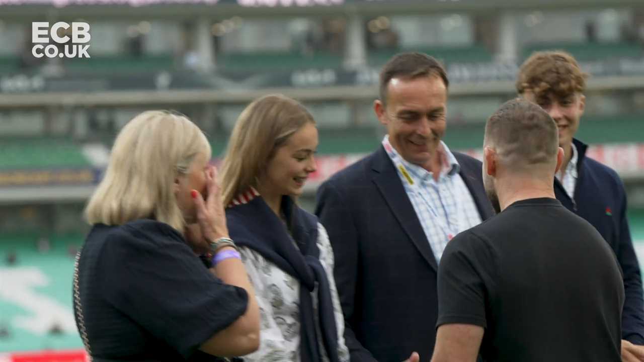 a group of people standing in a stadium with ecb.co.uk written on the bottom