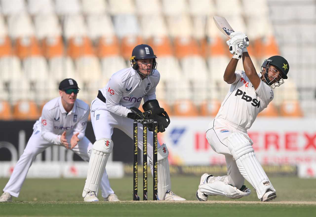 a cricket player wearing a pepsi jersey swings his bat