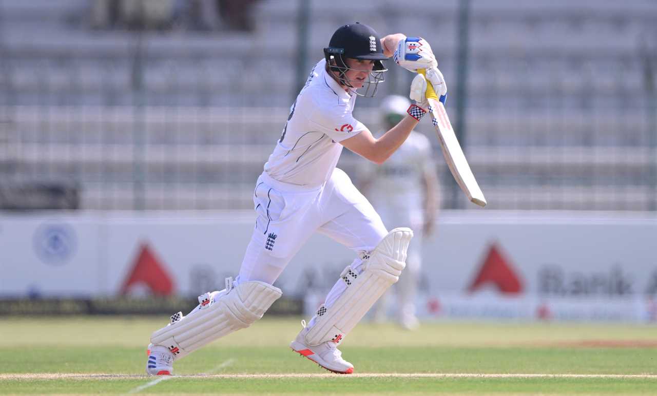 a cricket player with the number 1 on his shirt