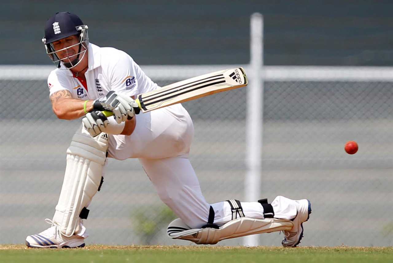 a cricket player wearing a white shirt that says b2 on it