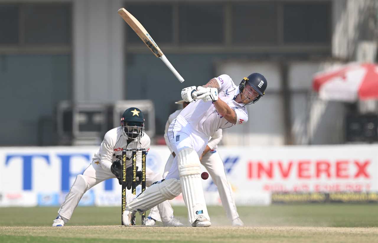 a cricket player swings his bat in front of an inverex sign