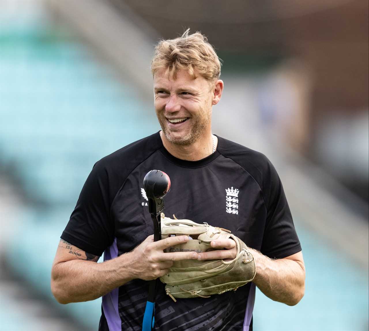 a man wearing a black shirt with the word england on it