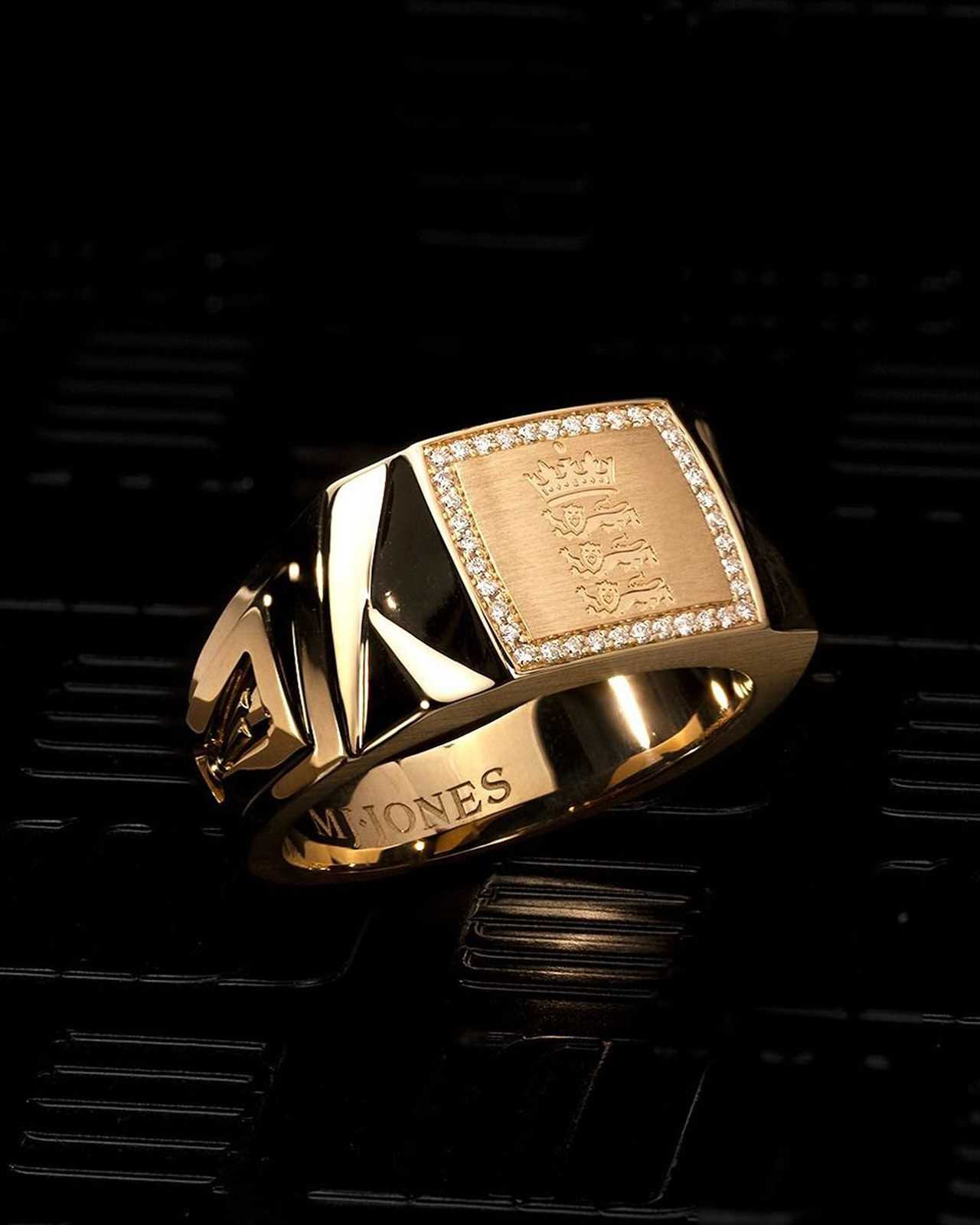 a gold ring with the word whones on it