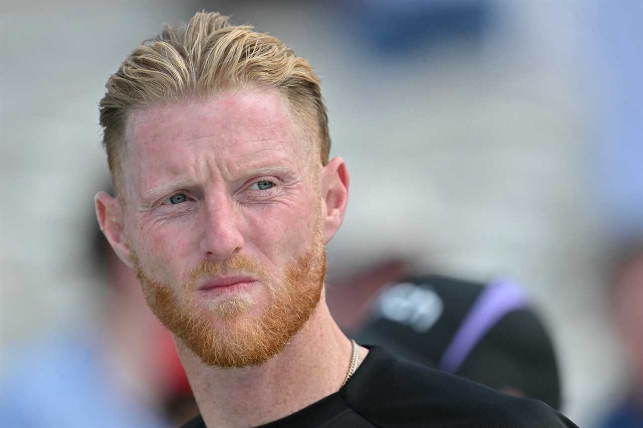 a man with a beard and blonde hair is wearing a black shirt