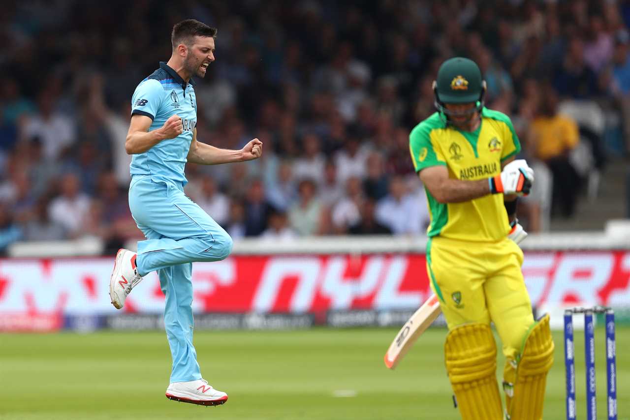 a cricket player wearing a jersey that says australia on it