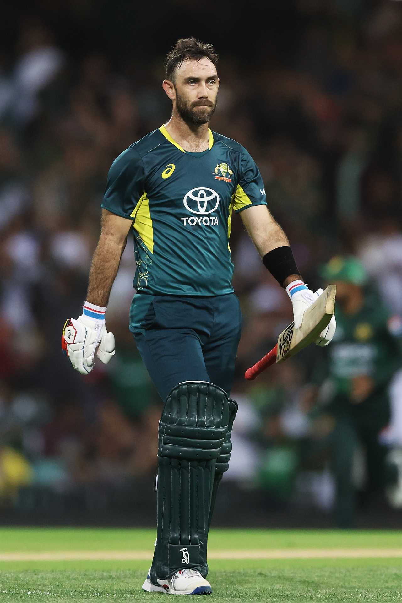 a man in a toyota jersey holds his bat