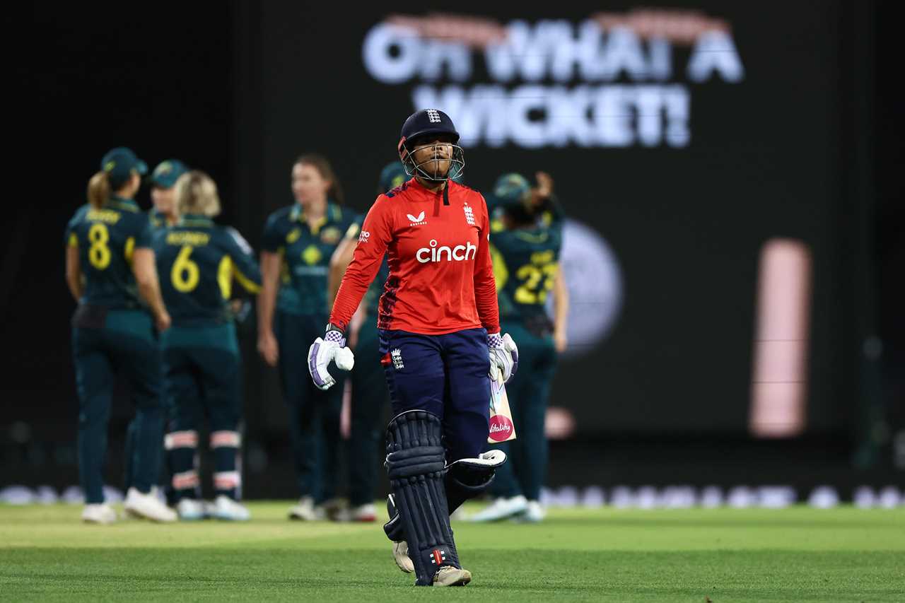 Sophia Dunkley of England walking off the cricket field after being dismissed.