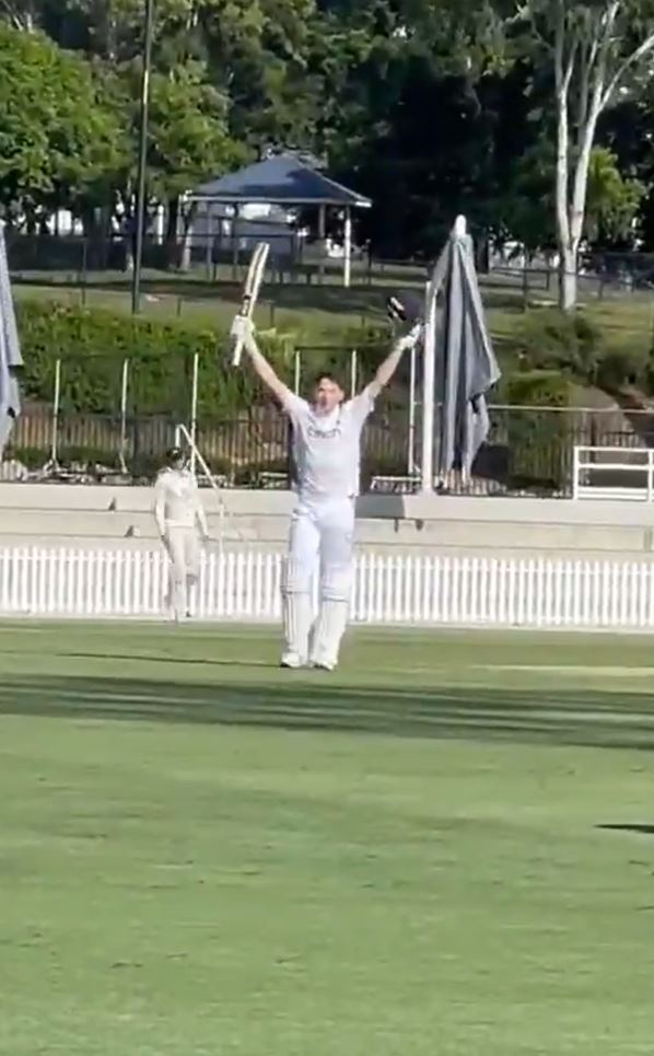 Cricket player celebrating victory.