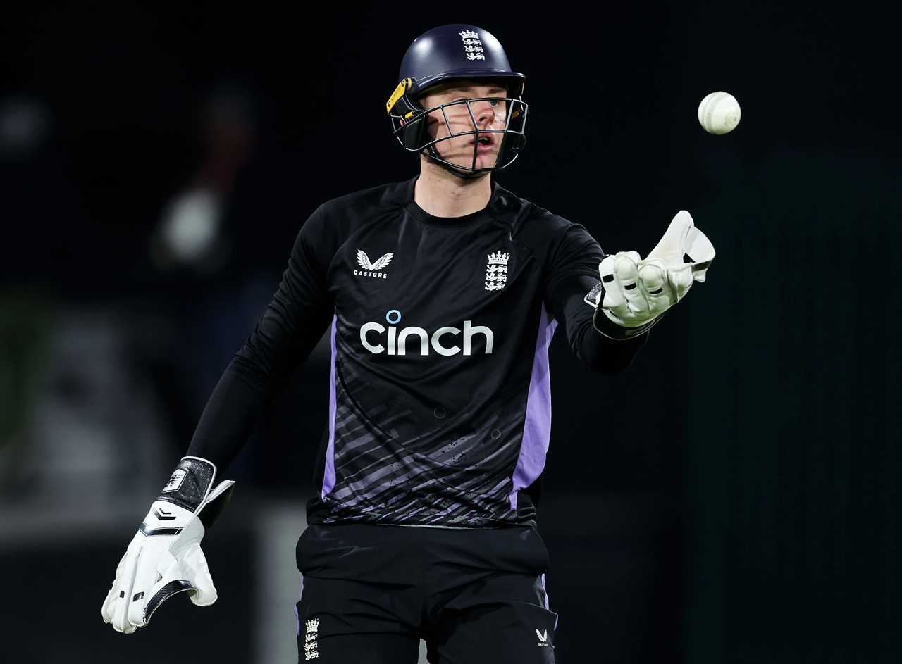 Jamie Smith of England catching a cricket ball during a nets session.