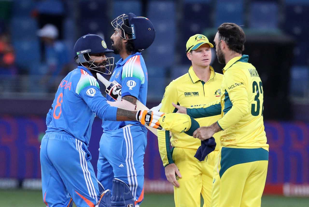 Indian and Australian cricket players shaking hands after a match.