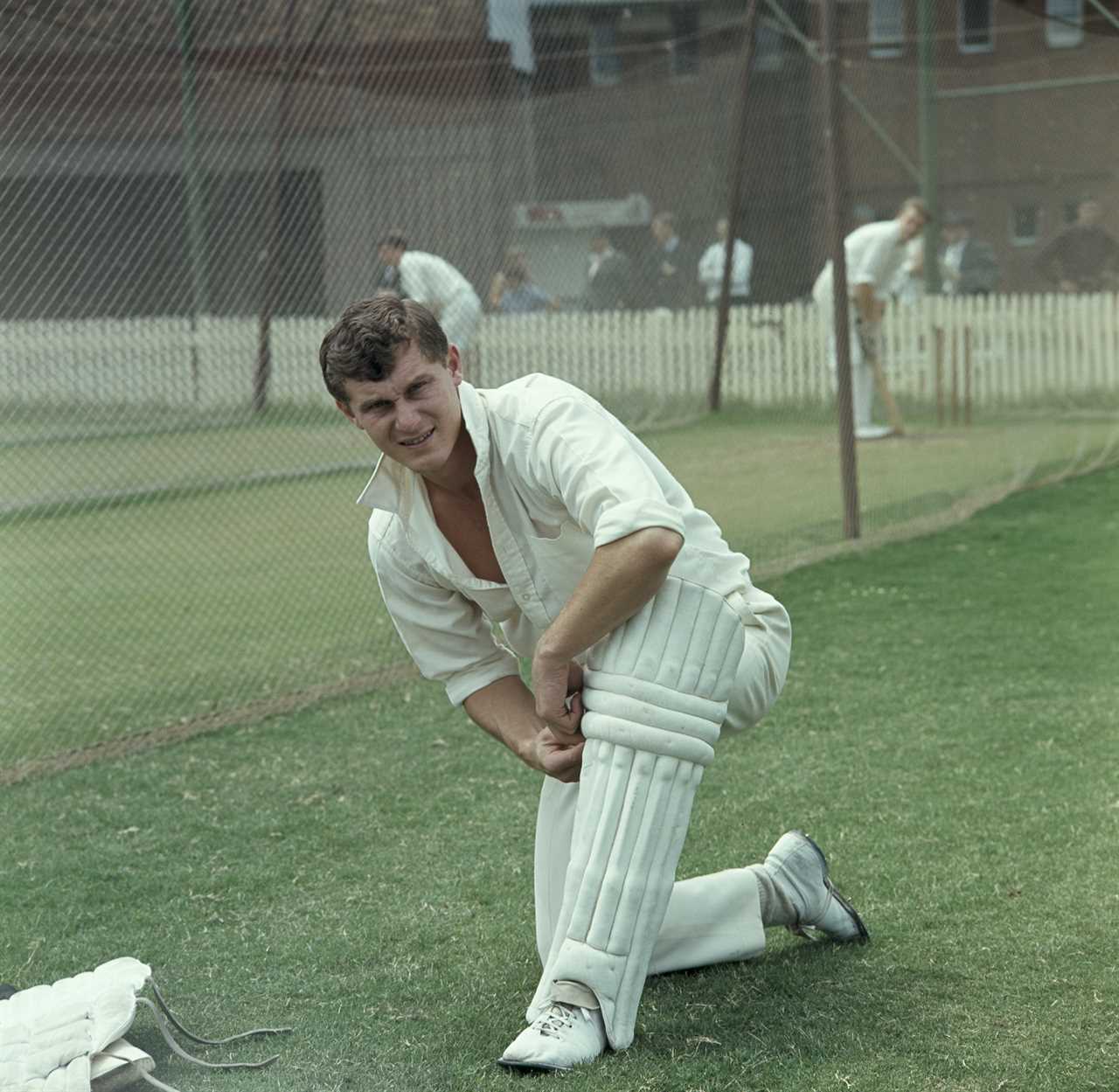 Bob Cowper, Australian cricketer, kneeling during net practice.
