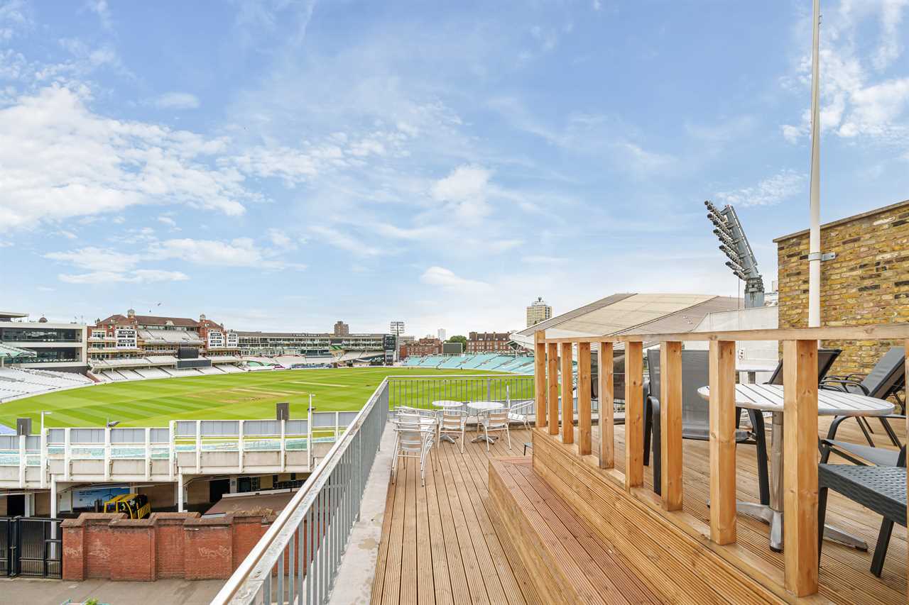 Rooftop patio overlooking a cricket field.