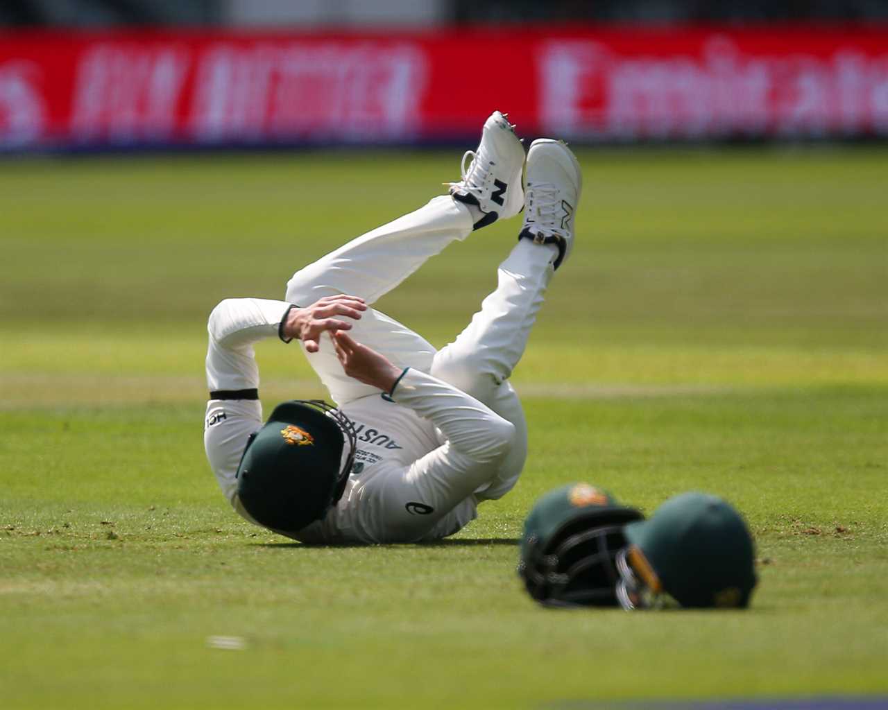 Steve Smith of Australia on the ground after dropping a catch.