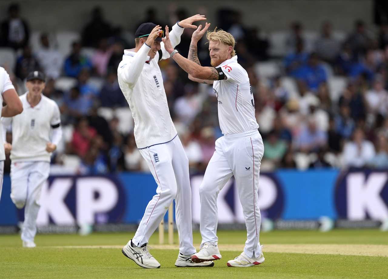 England cricket players Ben Stokes and another player celebrating a wicket.