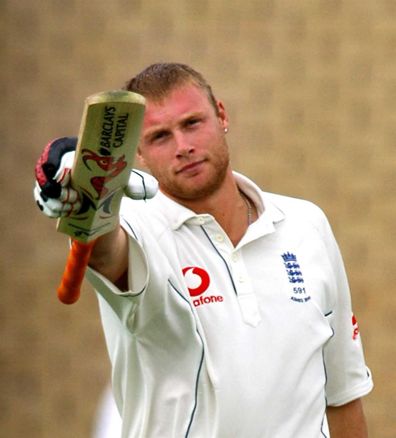 Andrew Flintoff holding up his cricket bat.