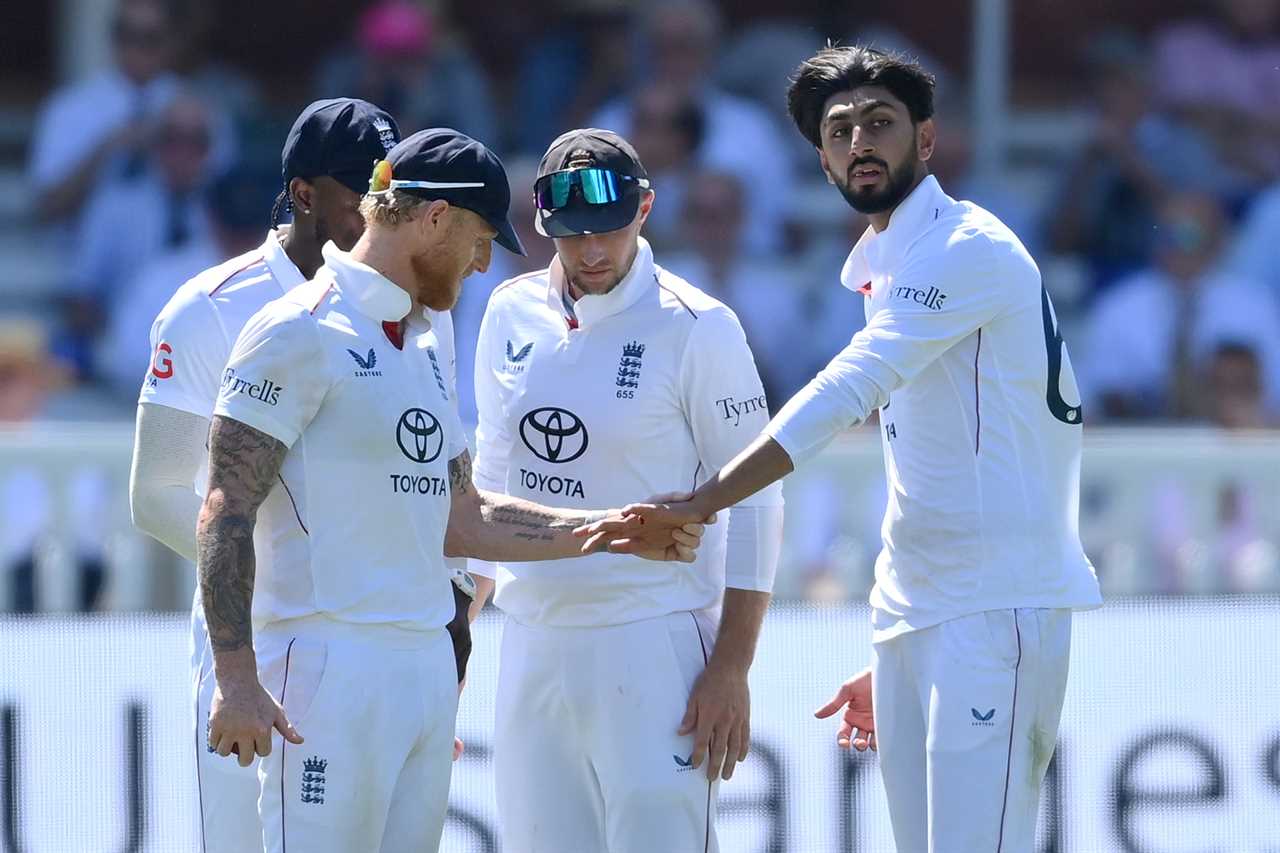 Shoaib Bashir shows Ben Stokes and Joe Root his injured finger.