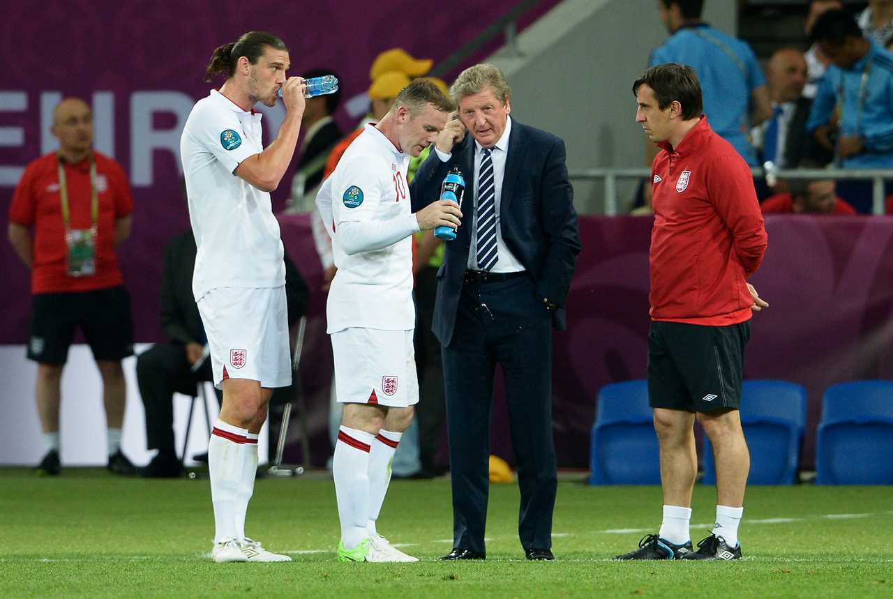 Roy Hodgson, Andy Carroll, and Wayne Rooney at a EURO 2012 quarter-final match.