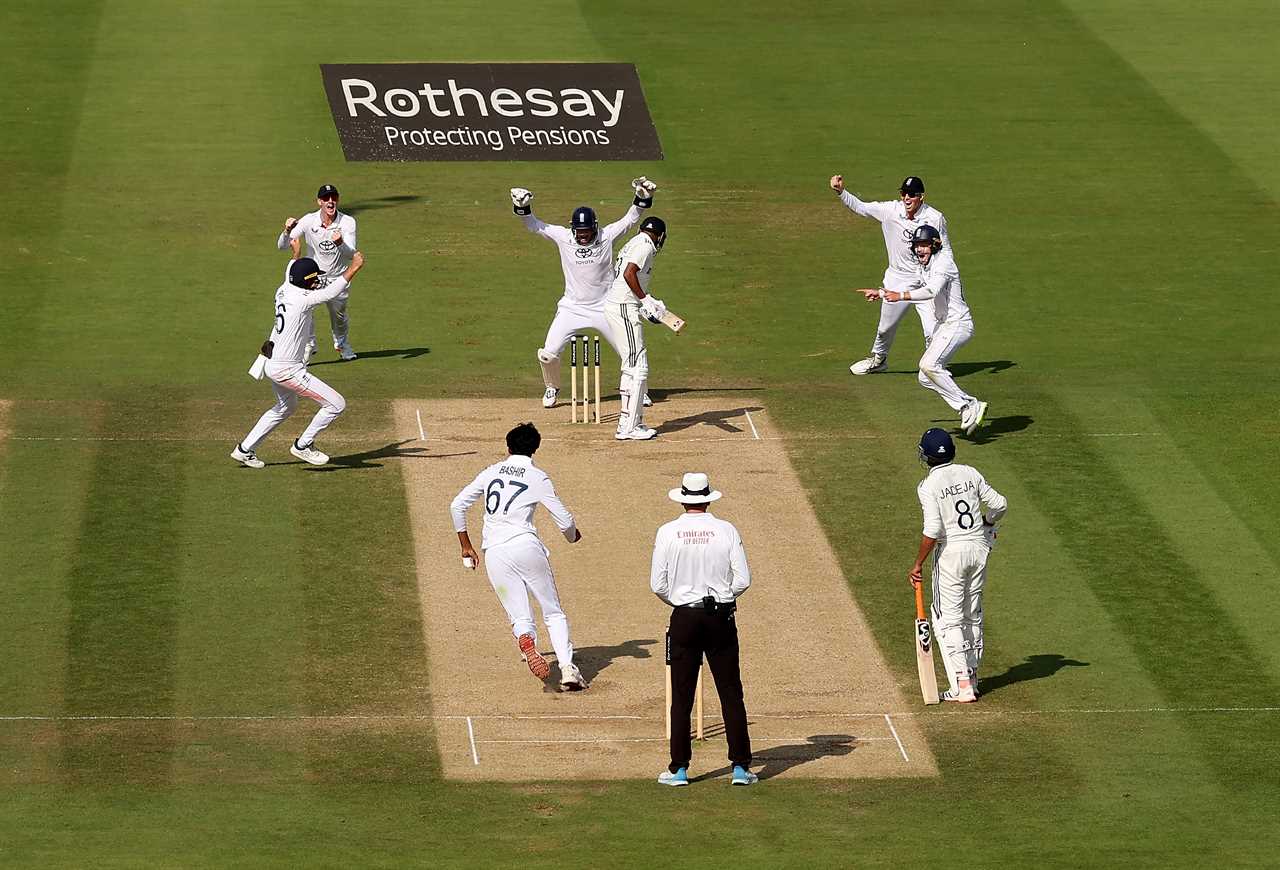 England cricket team celebrating a wicket at Lord's Cricket Ground.