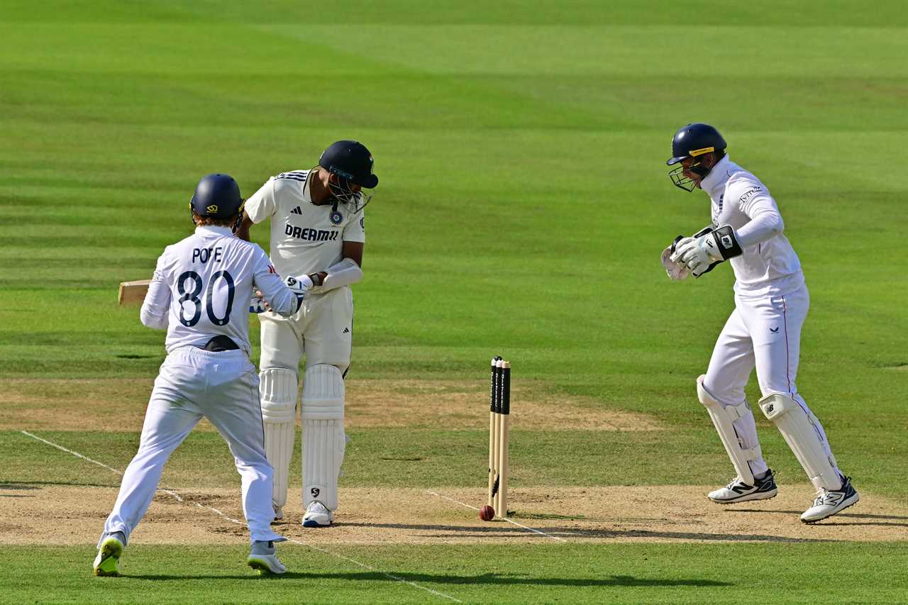 Cricket match: a ball hits the wickets.