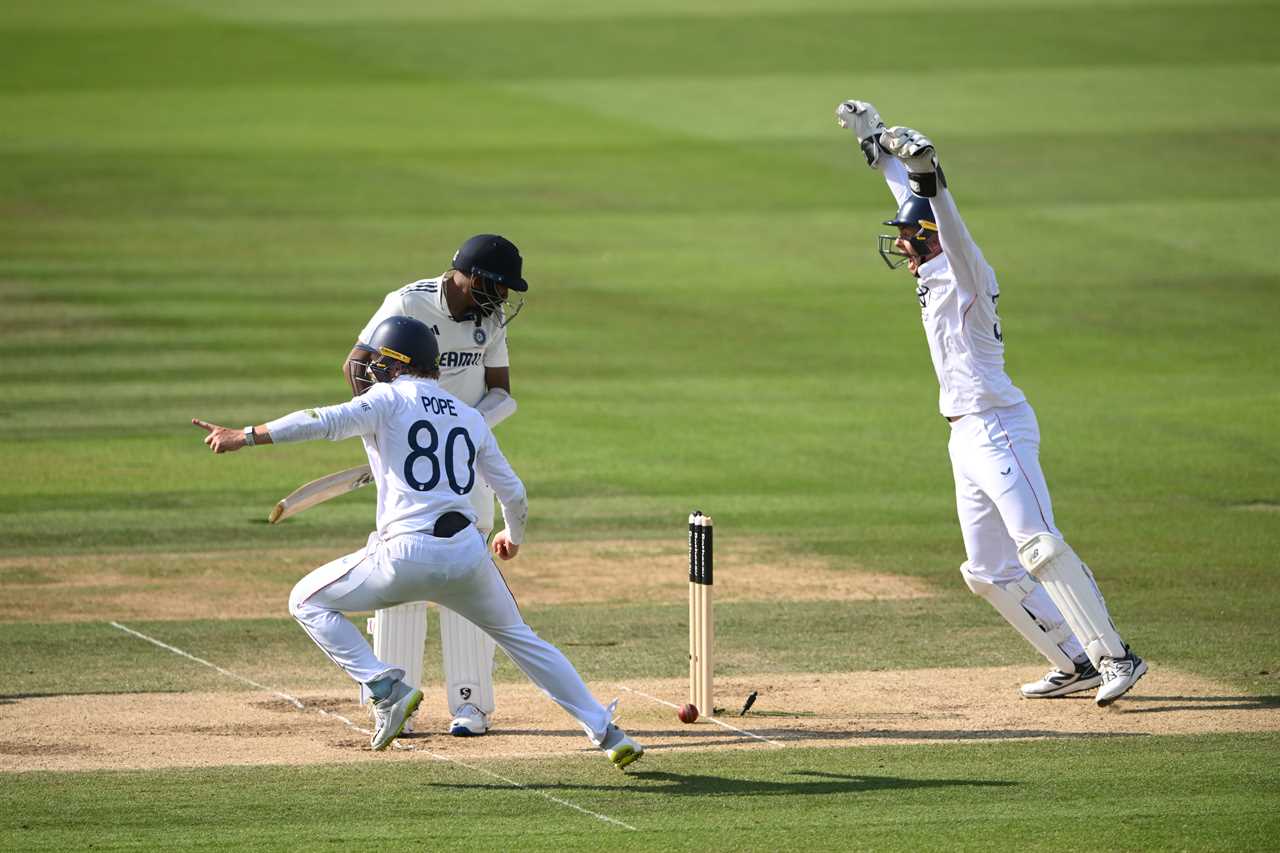 Cricket player bowled out; celebrating teammates.