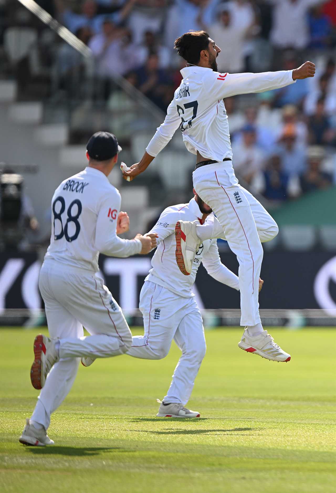 England cricket players celebrating a win.