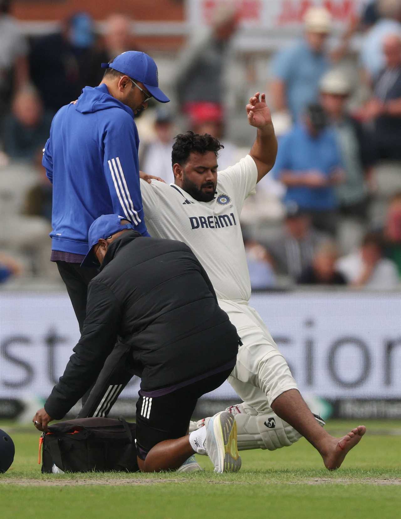 India's Rishabh Pant receiving medical attention on the cricket field.