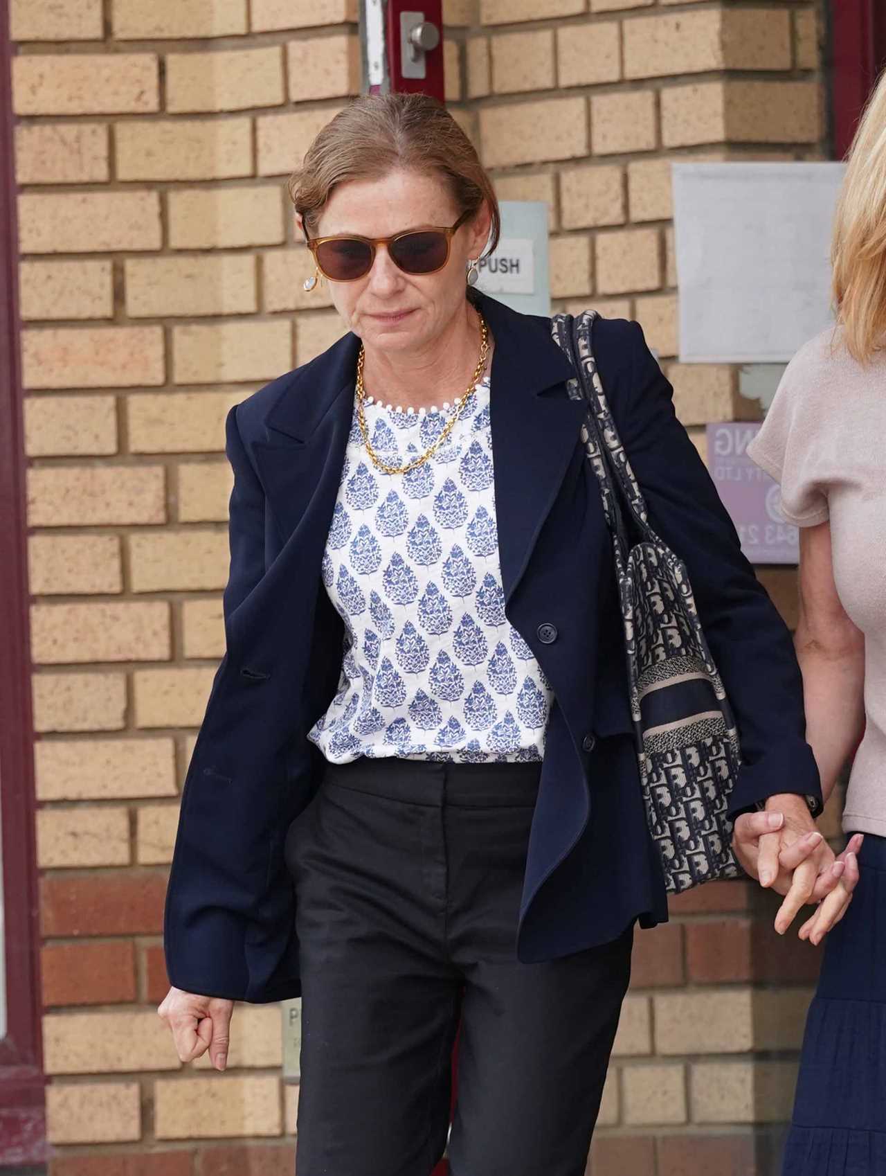 Amanda Thorpe, wife of the late Graham Thorpe, leaving court with a friend.