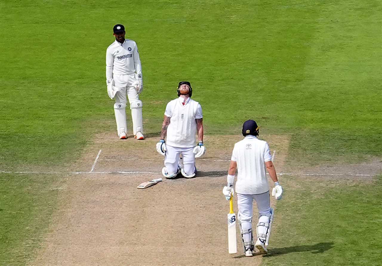 Ben Stokes reacts after being hit by a ball during a cricket match.