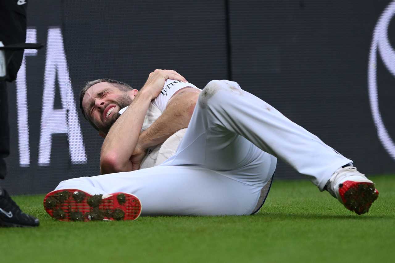 Chris Woakes of England in pain after injuring his shoulder.