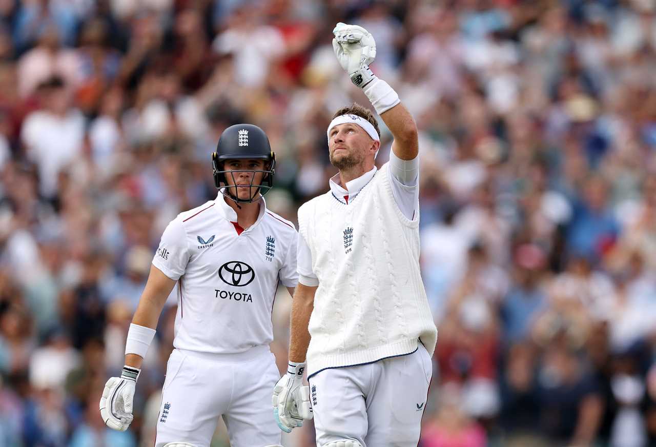 Joe Root of England points to the sky after scoring a century.