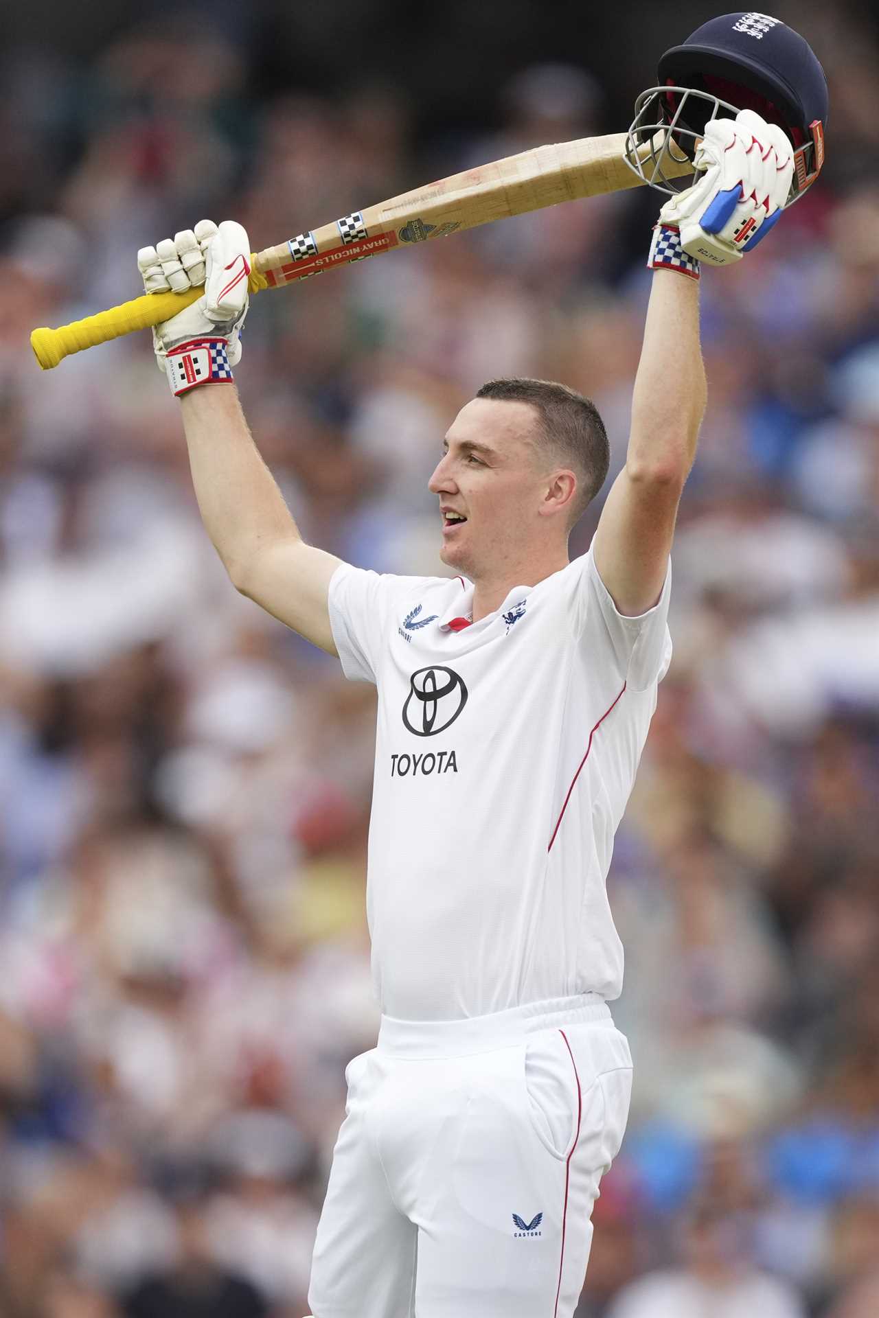 Harry Brook celebrates scoring a century in a cricket match.