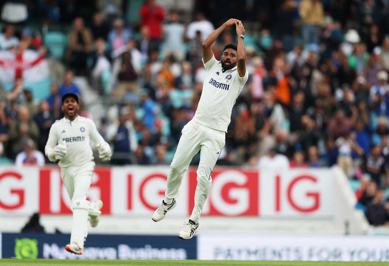 Mohammed Siraj celebrates taking a wicket in a cricket match.