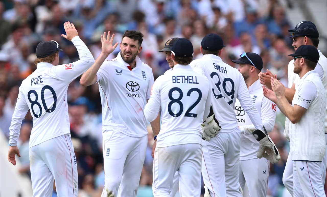 England cricket team celebrating a wicket.